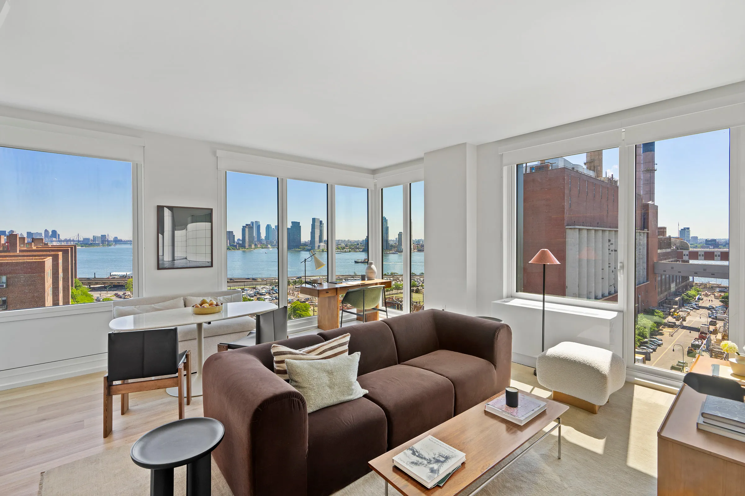 Staged corner living room with East River views