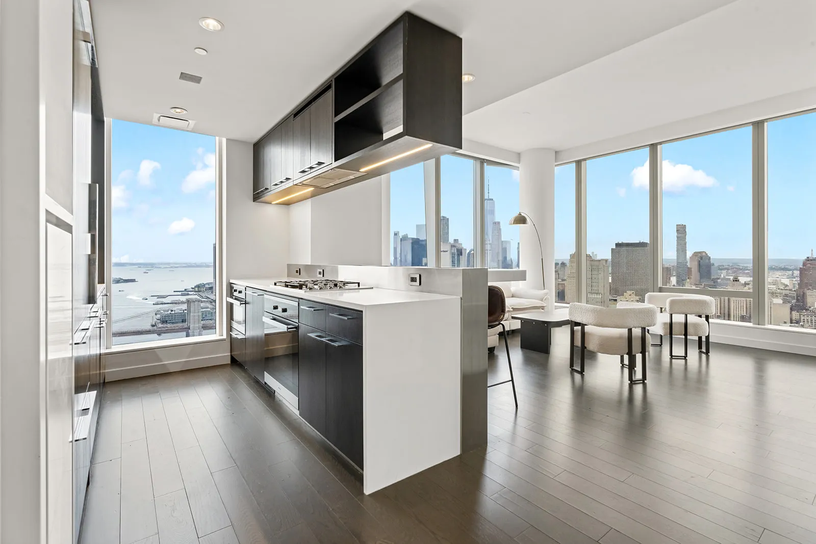 Open kitchen of a high-floor Manhattan residence with downtown skyline views